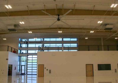 Inside shot of finished apoxy floors of the Triple C hanger at Scottsdale Airport with the bi-fold door closed